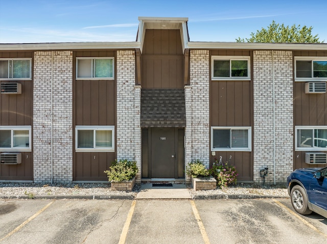 view of property featuring a wall mounted AC