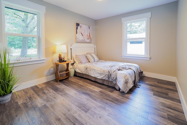 bedroom featuring dark hardwood / wood-style flooring