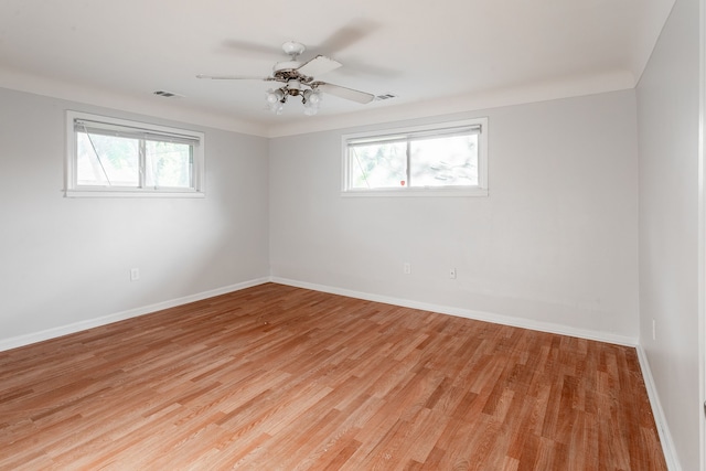 empty room featuring ceiling fan and light hardwood / wood-style floors