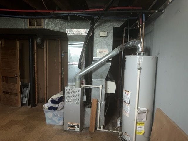 utility room with water heater