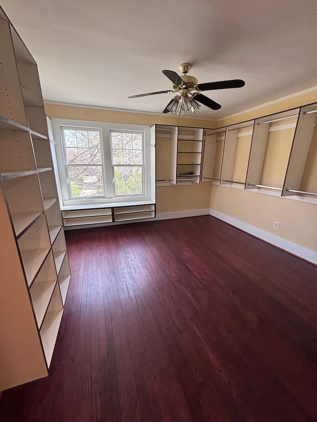 unfurnished room featuring dark hardwood / wood-style floors and ceiling fan