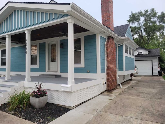 view of side of property with covered porch