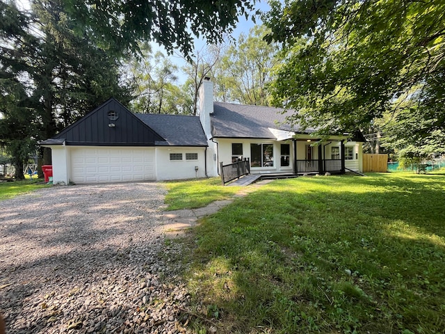 ranch-style home featuring a garage and a front yard