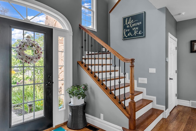 entryway with dark hardwood / wood-style floors