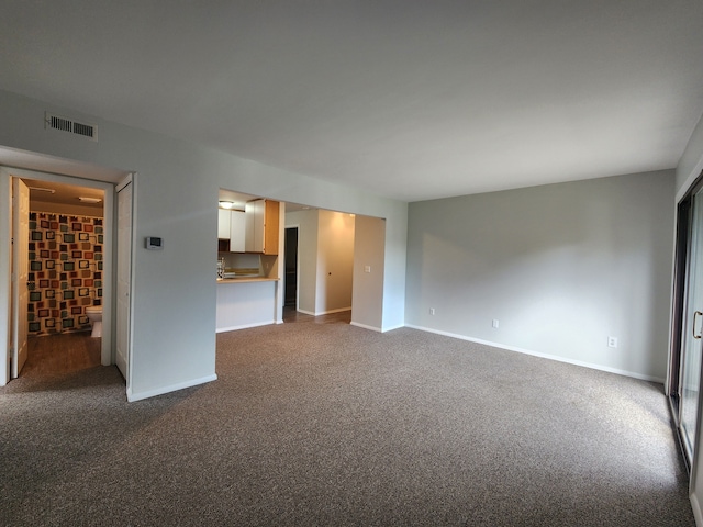 unfurnished living room with carpet flooring