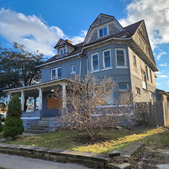 victorian house featuring covered porch