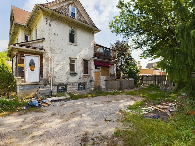 rear view of house with a balcony