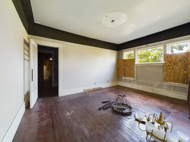 spare room featuring dark hardwood / wood-style flooring