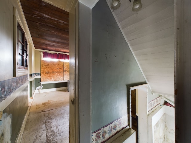 corridor featuring vaulted ceiling