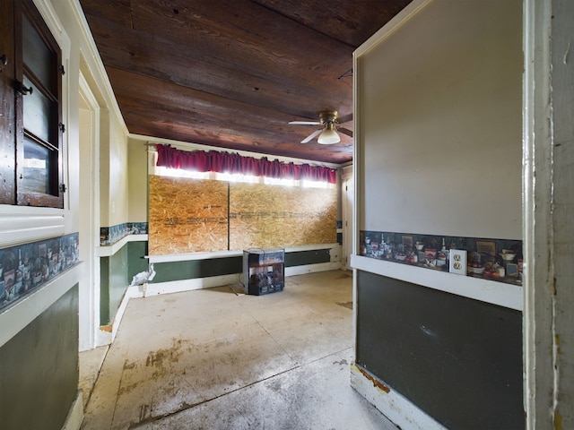 interior space with ceiling fan and wooden ceiling