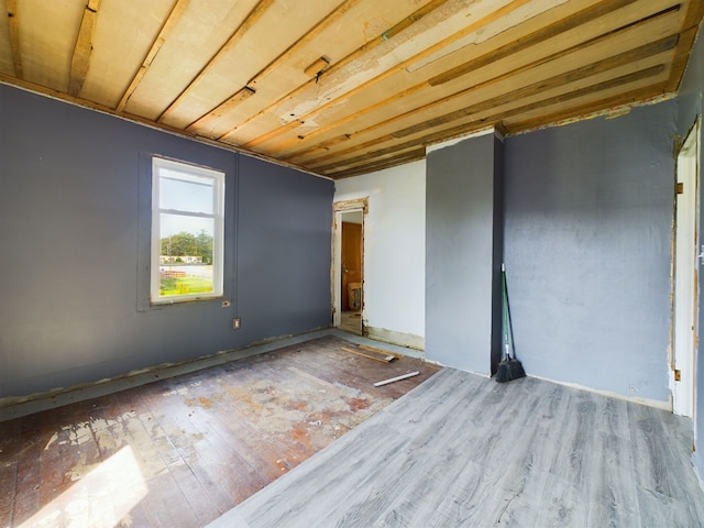 empty room with hardwood / wood-style floors