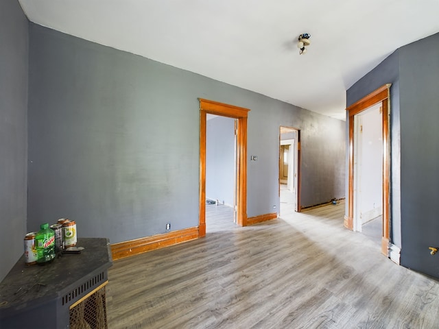 spare room with light hardwood / wood-style flooring