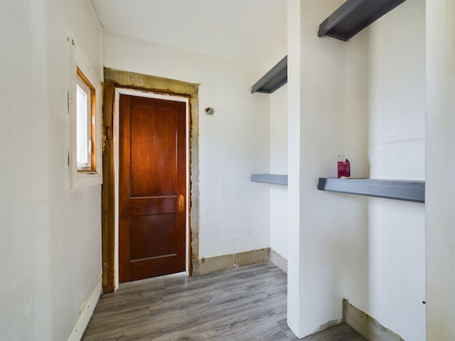 hall with wood-type flooring
