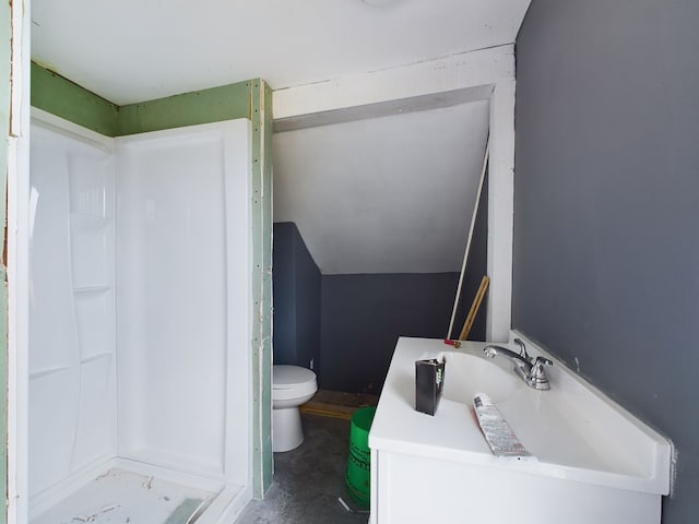 bathroom featuring vanity, a shower, vaulted ceiling, toilet, and concrete floors