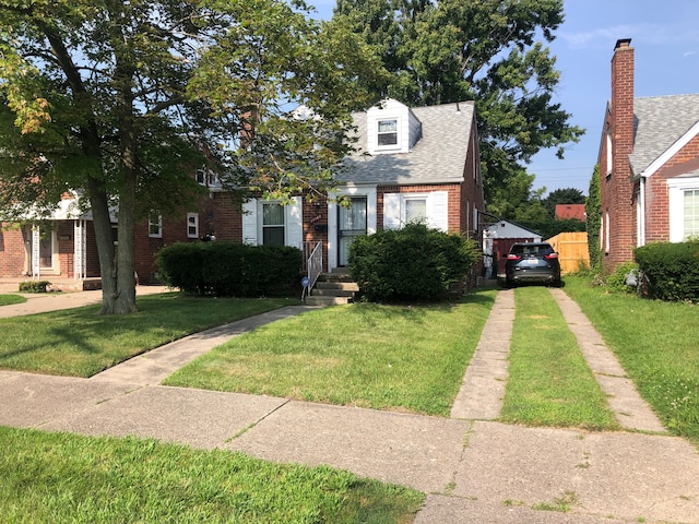 view of front of home featuring a front lawn