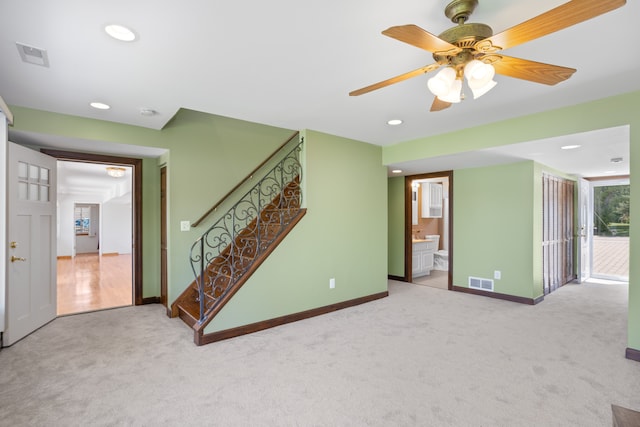 1794 S Hughes Rd, Brighton, MI 48114 - unfurnished living room featuring carpet flooring, stairs, recessed lighting, and a ceiling fan