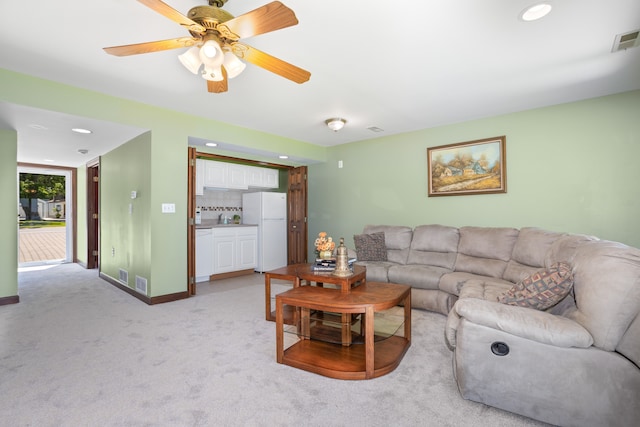 1794 S Hughes Rd, Brighton, MI 48114 - living room with light colored carpet, recessed lighting, and a ceiling fan