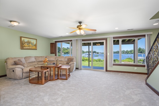 1794 S Hughes Rd, Brighton, MI 48114 - living room featuring a ceiling fan, carpet, a water view, and recessed lighting