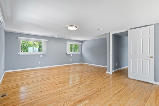 1794 S Hughes Rd, Brighton, MI 48114 - below grade area with light wood finished floors and baseboards