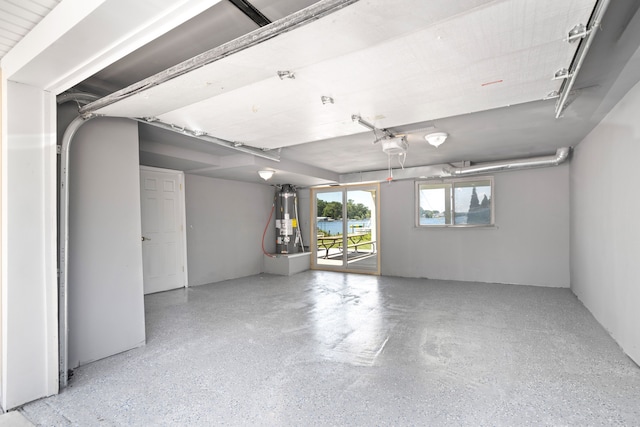 1794 S Hughes Rd, Brighton, MI 48114 - garage featuring water heater and a garage door opener