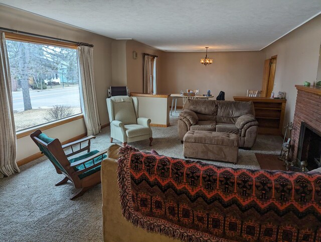 42294 Willson Memorial Dr, Chassell, MI 49916 - living room with carpet floors, a chandelier, baseboards, and a brick fireplace