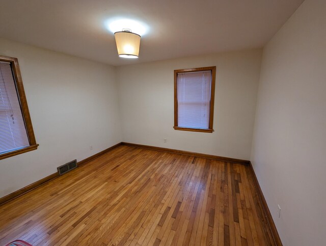 42294 Willson Memorial Dr, Chassell, MI 49916 - unfurnished room with light wood-type flooring and baseboards