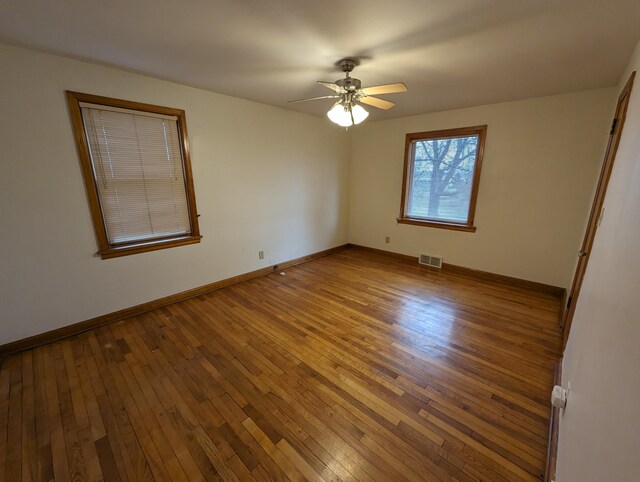 42294 Willson Memorial Dr, Chassell, MI 49916 - empty room with hardwood / wood-style flooring, a ceiling fan, and baseboards