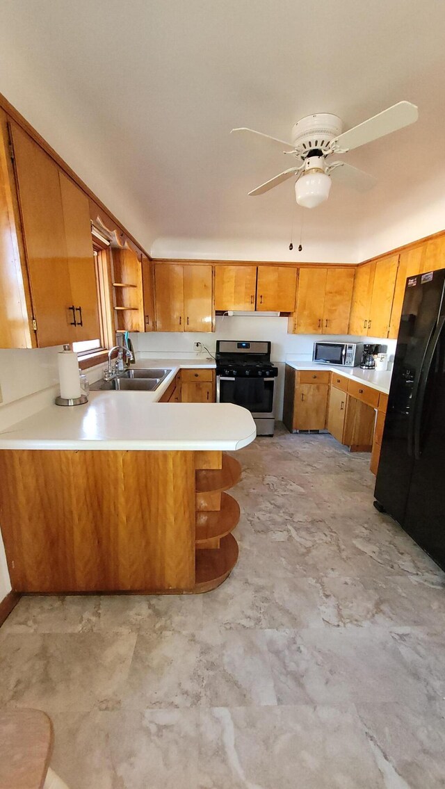 42294 Willson Memorial Dr, Chassell, MI 49916 - kitchen with appliances with stainless steel finishes, a sink, open shelves, a peninsula, and light countertops