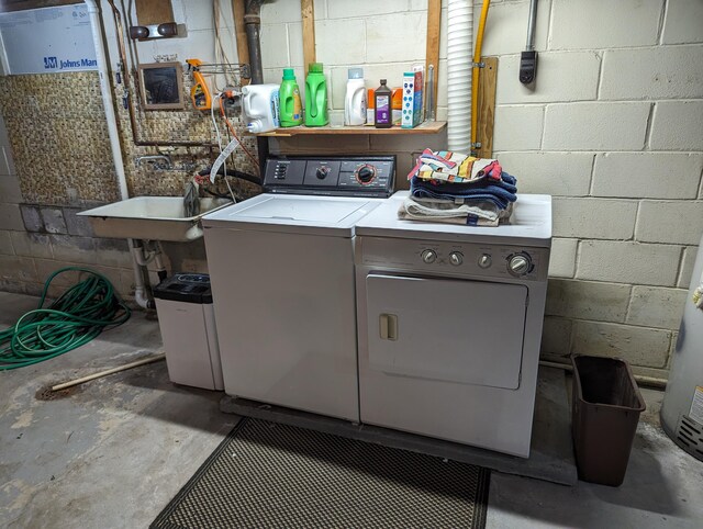 42294 Willson Memorial Dr, Chassell, MI 49916 - washroom featuring washing machine and clothes dryer and concrete block wall