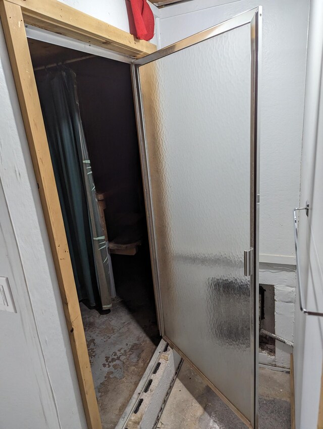 42294 Willson Memorial Dr, Chassell, MI 49916 - bathroom featuring concrete flooring and a stall shower