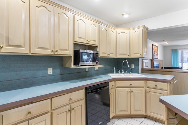 kitchen with dishwasher, sink, light brown cabinetry, and tasteful backsplash