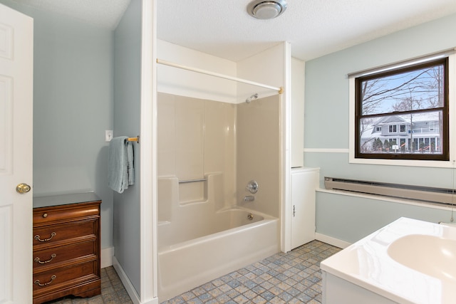 bathroom with a textured ceiling, vanity, a baseboard radiator, and shower / washtub combination