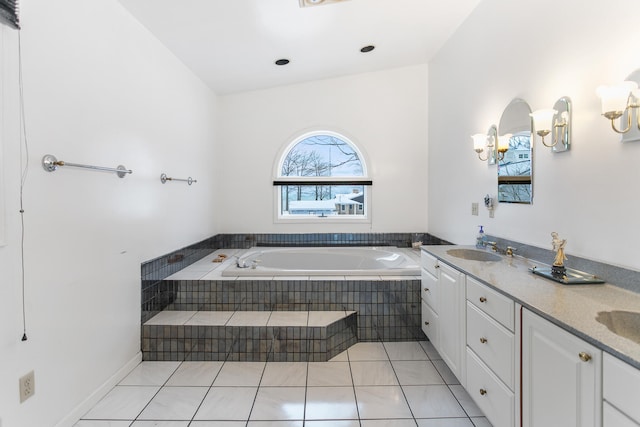 bathroom with tile patterned floors, vanity, and vaulted ceiling