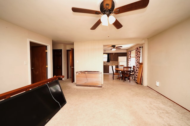 living room with carpet and ceiling fan