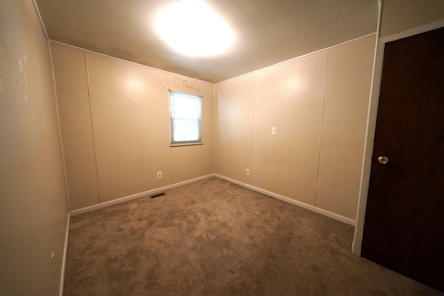 spare room featuring carpet flooring