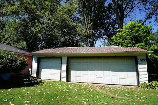 garage featuring a yard