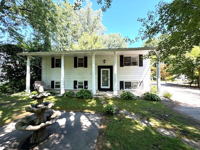 raised ranch featuring a front yard