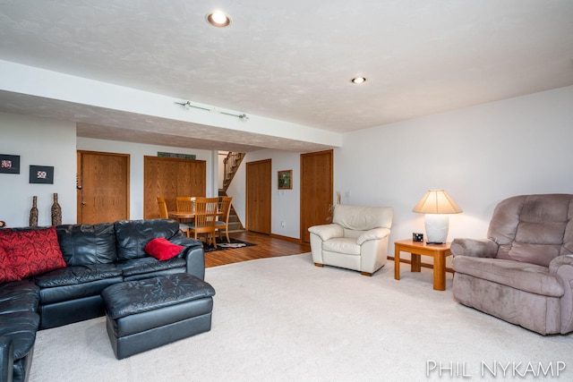 15111 Ransom St, Holland, MI 49424 - carpeted living room featuring stairs, recessed lighting, and wood finished floors