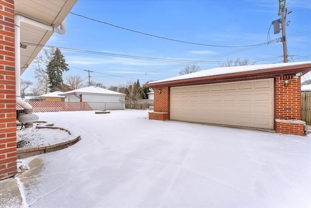 view of snow covered garage