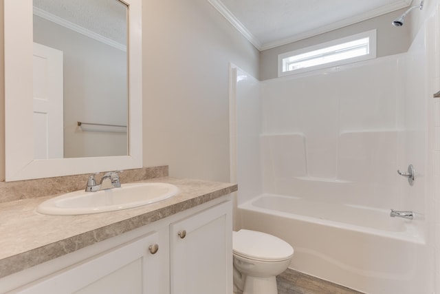 full bathroom with ornamental molding, vanity, a textured ceiling, shower / tub combination, and toilet