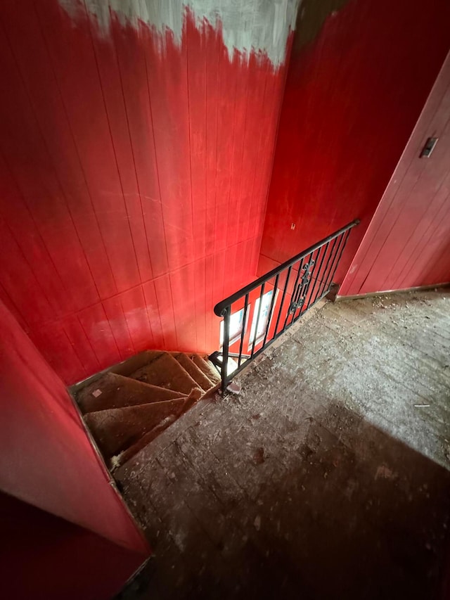 stairway featuring lofted ceiling