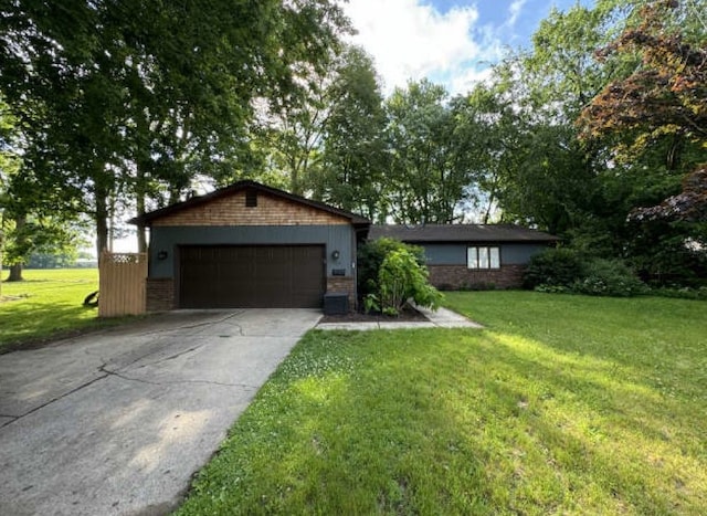 single story home with a garage and a front yard