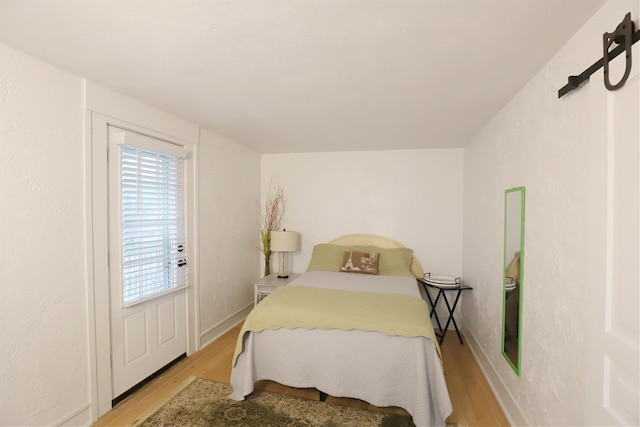 bedroom with light hardwood / wood-style floors