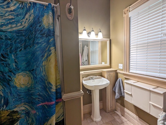 bathroom with tile patterned floors