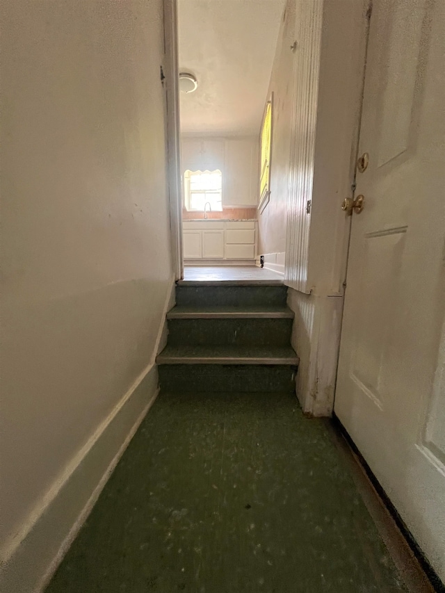 staircase featuring sink