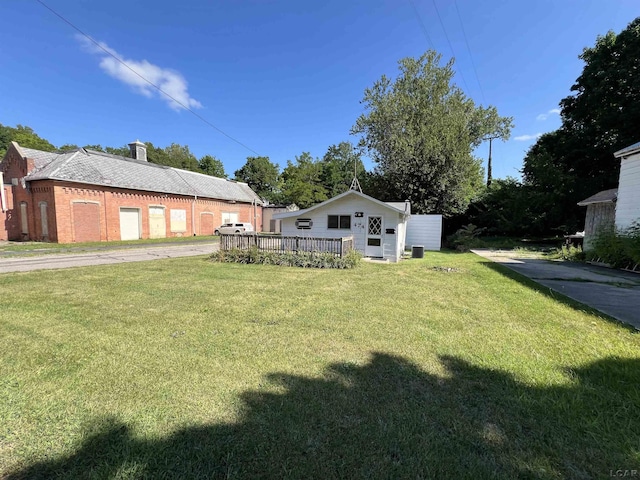 474 Merrick St, Adrian, MI 49221 - view of green lawn featuring a wooden deck