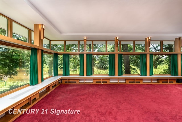 unfurnished sunroom with plenty of natural light