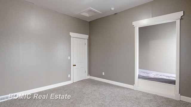 unfurnished bedroom featuring carpet