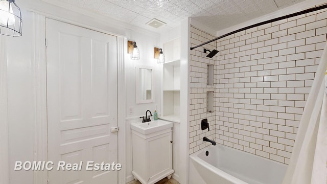 bathroom featuring vanity and shower / bath combo with shower curtain