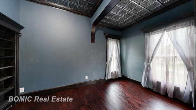 unfurnished room featuring dark hardwood / wood-style floors